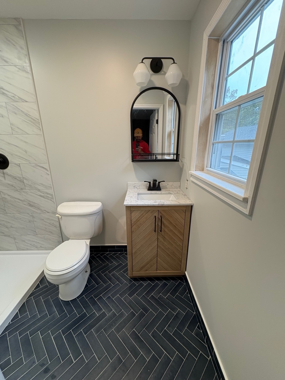 Bathroom renovation showing new tiling and updated finishes