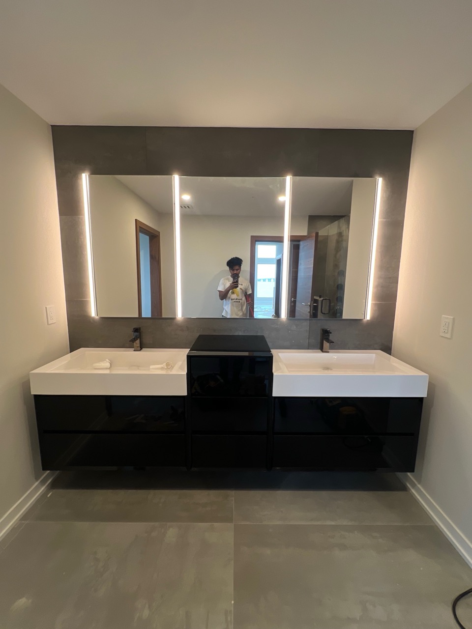 Bathroom remodel featuring updated flooring and vanity