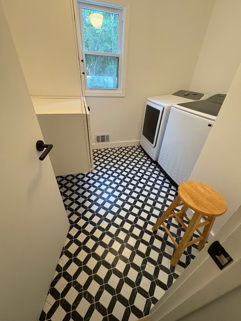 Laundry room renovation with new cabinetry and improved shelving