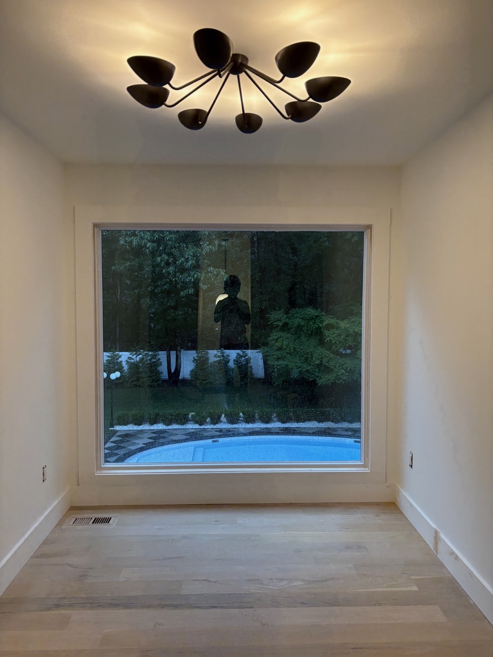 Room renovation after image with upgraded finishes and new layout