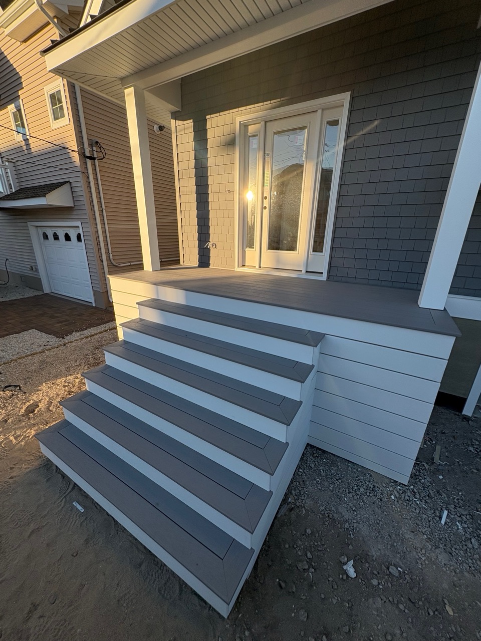 Staircase renovation after image featuring new steps and updated trim